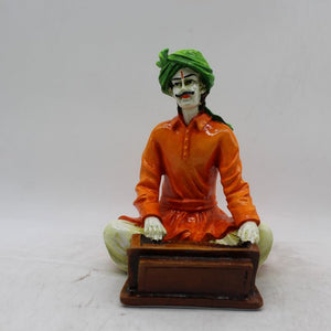 Rajasthani boy,Rajasthani man,Musician man Rajasthani statue, idol Orange color